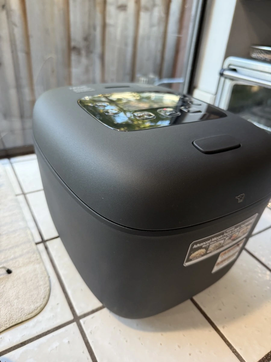 Matte-black Zojirushi NL-EAC18BA 10-cup rice cooker on my kitchen counter